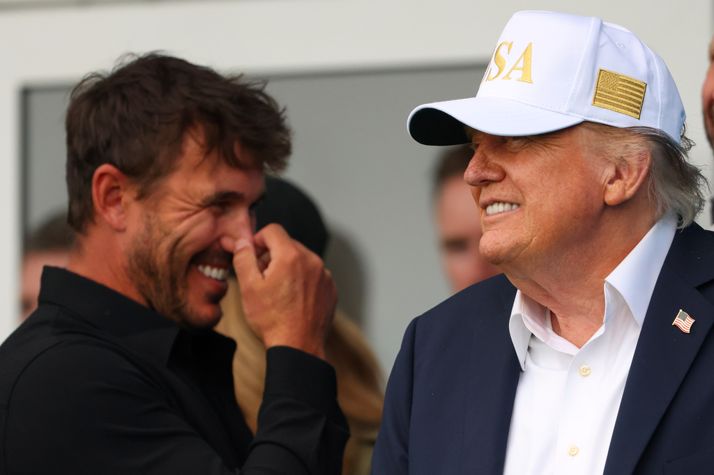 U.S. President Donald Trump and US golfer Brooks Koepka watch the play during the Irish Open at the Trump International Golf Links course in Doonbeg, Ireland, Saturday, Sept. 12, 2026.(AP Photo/Peter Morrison)
