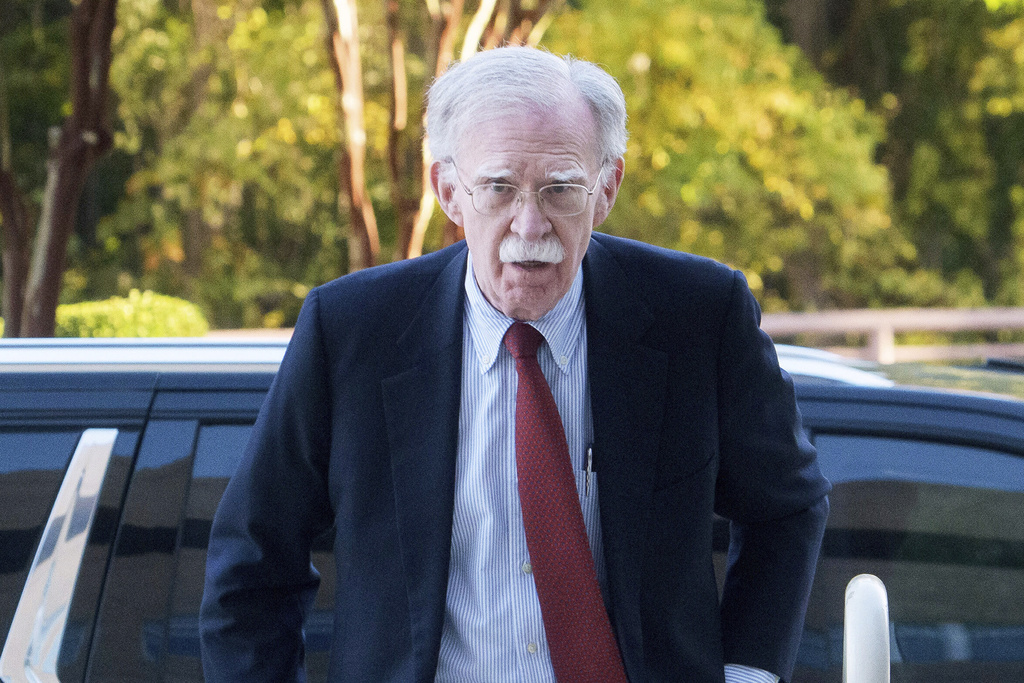 Former Trump administration national security adviser John Bolton, left, arrives for his arraignment at the federal courthouse in Greenbelt, Md., Friday, Oct. 17, 2025. (AP Photo/Rod Lamkey, Jr.)