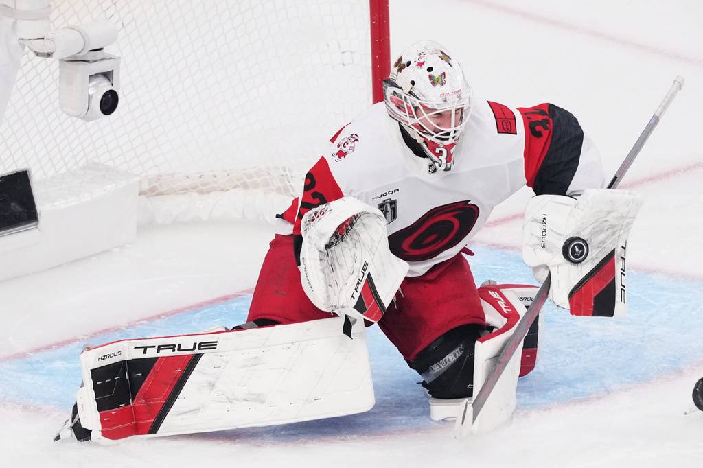 FILE - Carolina Hurricanes goaltender Brandon Bussi (32) stops a shot on goal during the second period in Game 6 of the NHL hockey Stanley Cup Final series against the Vegas Golden Knights, Sunday, June 14, 2026, in Las Vegas. (AP Photo/Candice Ward, File)