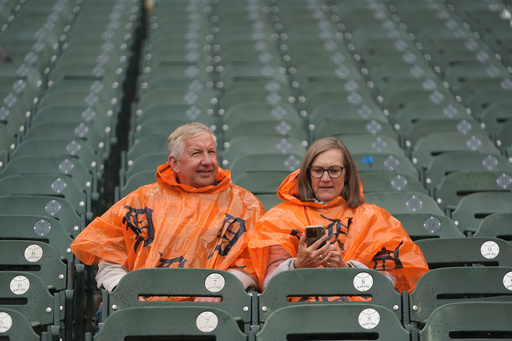Fans sit in the stands as drizzle falls while waiting for the start of Game 3 of baseball's American League Division Series between the Detroit Tigers and the Seattle Mariners Tuesday, Oct. 7, 2025, in Detroit. (AP Photo/Paul Sancya) Fans sit in the stands as drizzle falls while waiting for the start of Game 3 of baseball's American League Division Series between the Detroit Tigers and the Seattle Mariners Tuesday, Oct. 7, 2025, in Detroit. (AP Photo/Paul Sancya)