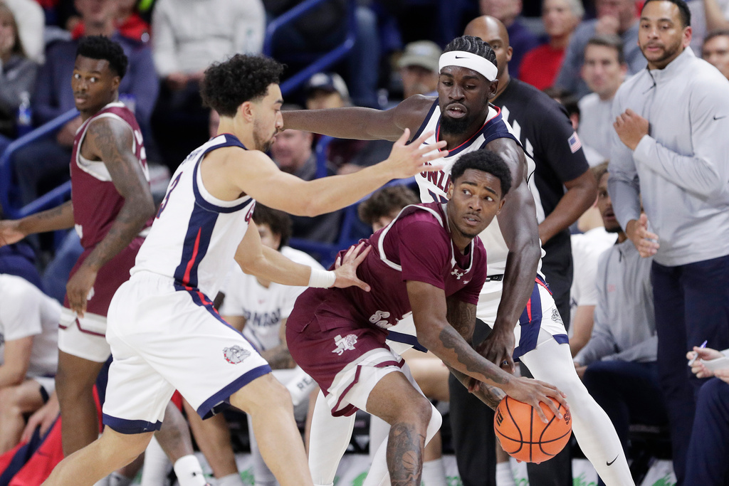 Gonzaga guard Braeden Smith, left, and forward Graham Ike, right, double team Texas Southern guard Jaylen Wysinger during the first half of an NCAA college basketball game, Monday, Nov. 3, 2025, in Spokane, Wash. (AP Photo/Young Kwak)