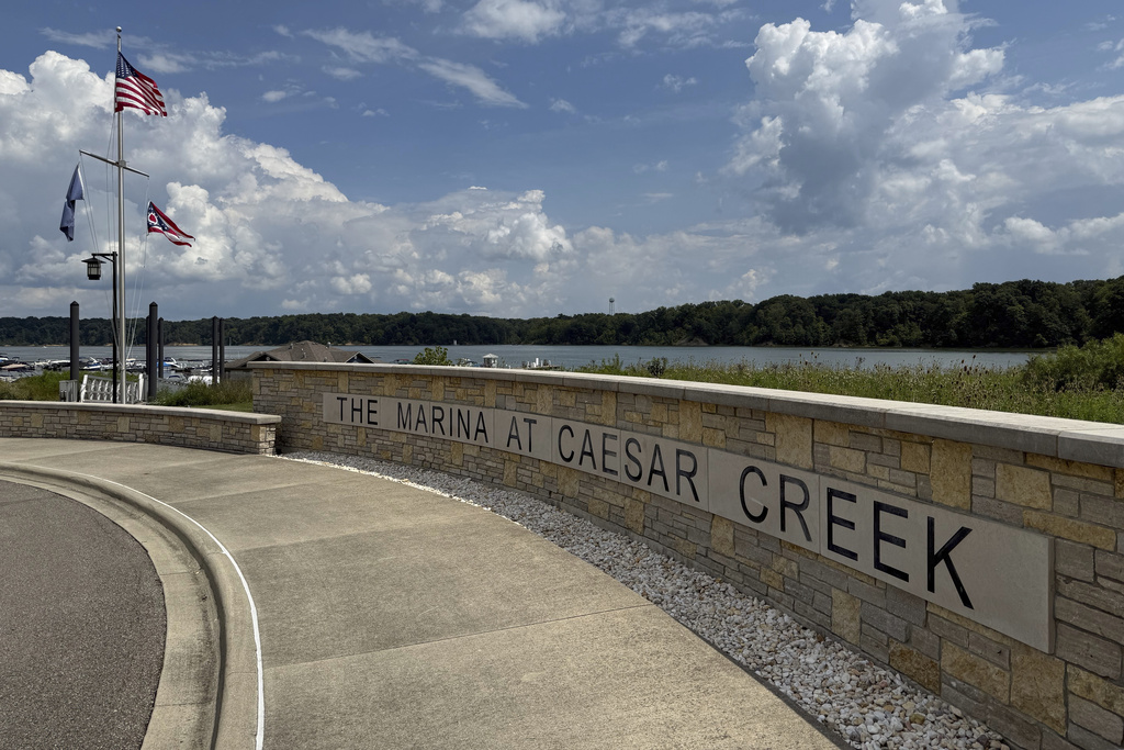 Flags fly at Caesar Creek Marina at Caesar Creek State Park in Waynesville, Ohio, Thursday, Aug. 7, 2025. (AP Photo/Patrick Aftoora-Orsagos)
