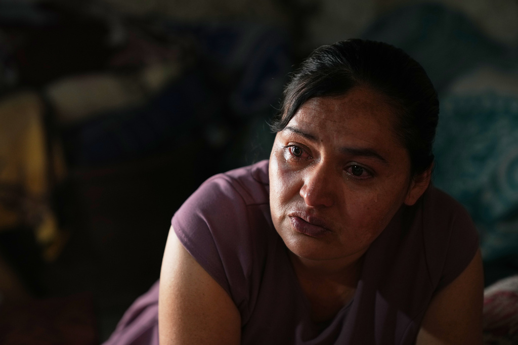 Mirsy Maricela Alva Lopez, a Guatemalan migrant who has been separated from her son Ederson twice, cries during an interview at her parents' house in San Martín Cuchumatán, Guatemala, Thursday, April 30, 2026. (AP Photo/Moises Castillo)