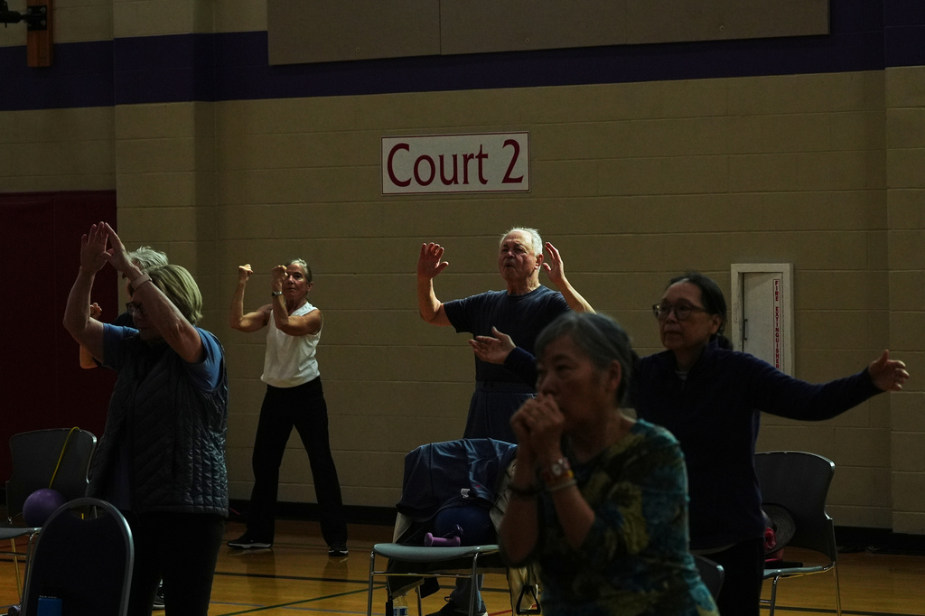 Participants do arm exercises in a class for older adults led by instructor Bengie Santos, 72, at the Dale Turner Family YMCA, April 30, 2026, in Shoreline, Wash. (AP Photo/Lindsey Wasson)
