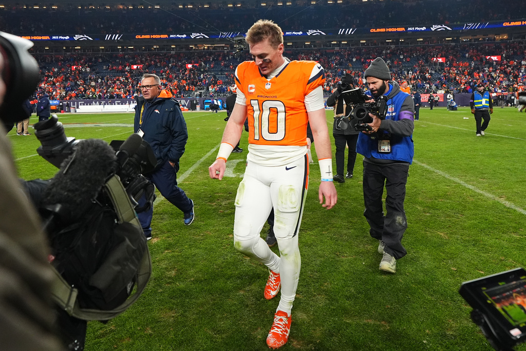 Denver Broncos quarterback Bo Nix leaves the field after an NFL divisional round playoff football game against the Buffalo Bills, Saturday, Jan. 17, 2026, in Denver. (AP Photo/Jack Dempsey)