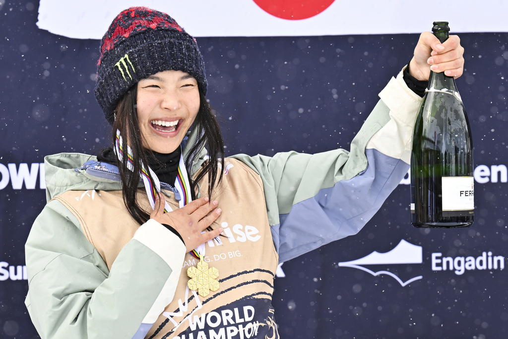 FILE - Gold medalist Chloe Kim of USA reacts on the podium after the Women's Snowboard Halfpipe competition at the FIS Snowboard, Freestyle and Freeski World Championships in St. Moritz, Switzerland, Saturday, March 29, 2025. (Gian Ehrenzeller/Keystone via AP, File)