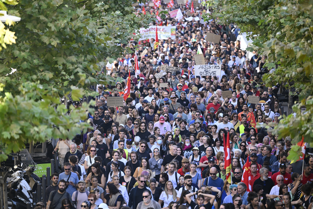Protesters march during a rally of the "Block Everything" movement in Marseille, south of France, Wednesday, Sept. 10, 2025. (AP Photo/Philippe Magoni)