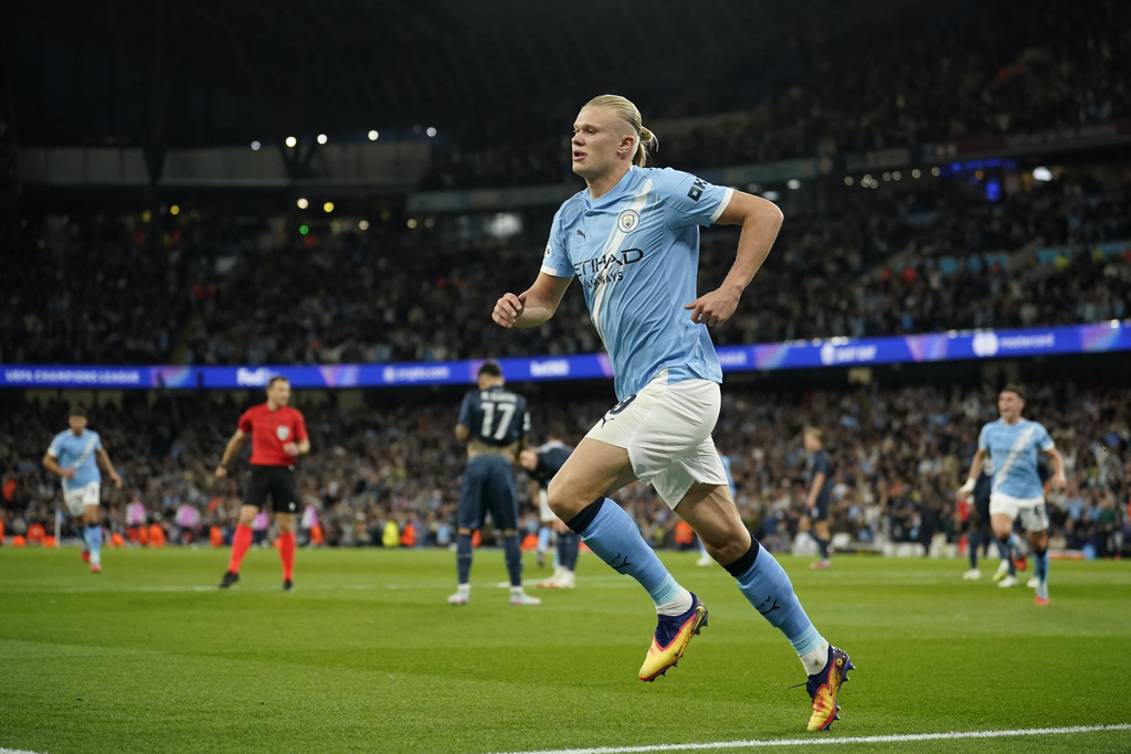 Manchester City's Erling Haaland celebrates after scoring the opening goal during the Champions League opening phase soccer match between Manchester City and Napoli at the Etihad Stadium in Manchester, England, Thursday, Sept. 18, 2025. (AP Photo/Dave Thompson)