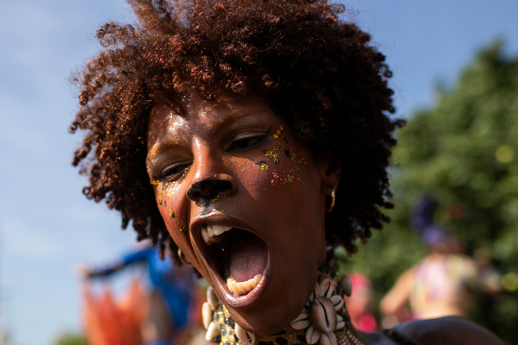 A reveler performs during the Amigos da Onca Carnival street party in Rio de Janeiro, Saturday, Feb. 14, 2026. (AP Photo/Bruna Prado)