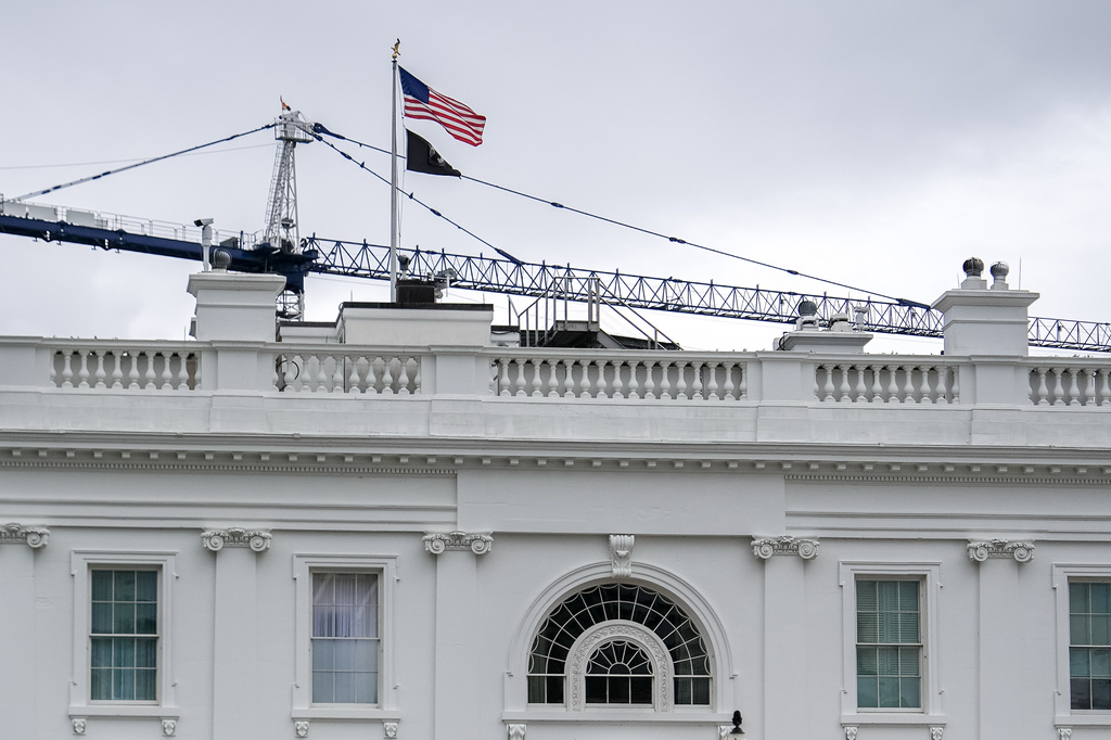 A crane being used to construct the new White House ballroom is seen above the White House, Sunday, April 19, 2026, in Washington. (AP Photo/Julia Demaree Nikhinson)
