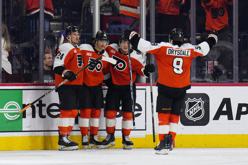 Philadelphia Flyers' Trevor Zegras, second from left, celebrates with Nick Seeler (24), Jamie Drysdale (9) and Matvei Michkov after scoring a goal during the third period of an NHL hockey game against the New York Islanders, Saturday, Oct. 25, 2025, in Philadelphia. (AP Photo/Derik Hamilton) Philadelphia Flyers' Trevor Zegras, second from left, celebrates with Nick Seeler (24), Jamie Drysdale (9) and Matvei Michkov after scoring a goal during the third period of an NHL hockey game against the New York Islanders, Saturday, Oct. 25, 2025, in Philadelphia. (AP Photo/Derik Hamilton)