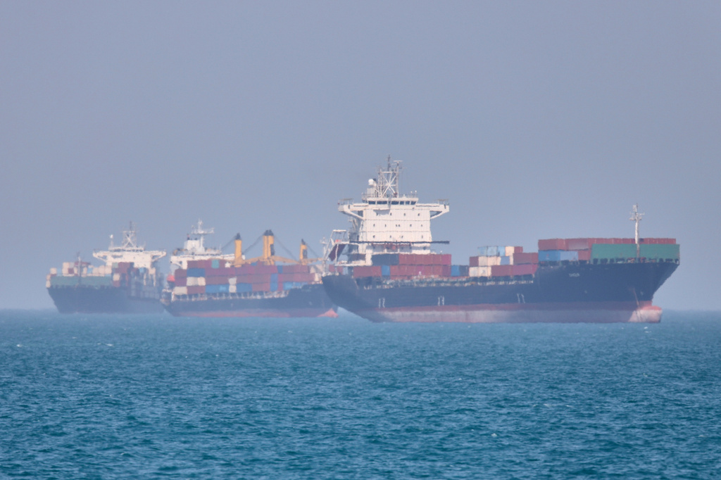 Container ships sit at anchor in the Strait of Hormuz off Bandar Abbas, Iran, Saturday, May 2, 2026.(Amirhosein Khorgooi/ISNA via AP)