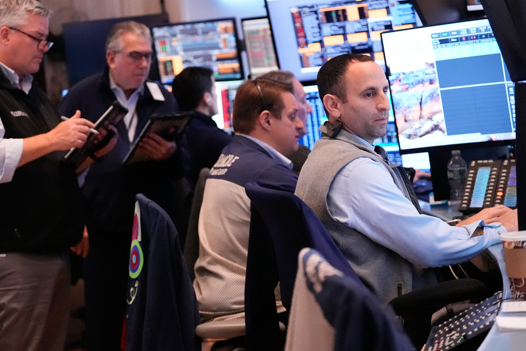 Traders work on the floor at the New York Stock Exchange in New York, Thursday, Nov. 13, 2025. (AP Photo/Seth Wenig)