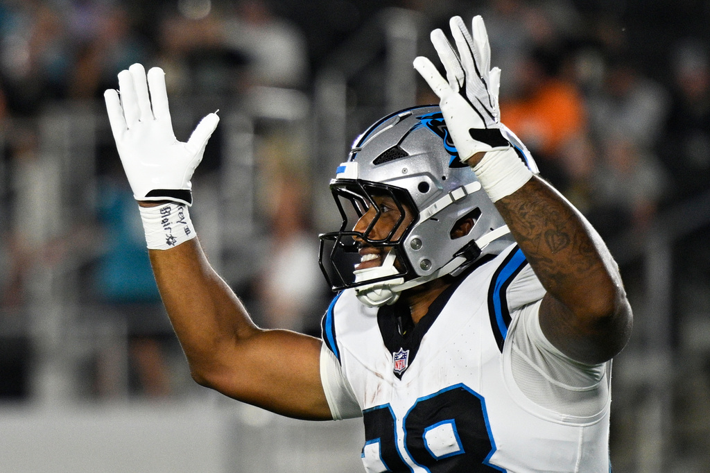 Carolina Panthers running back AJ Dillon celebrates after scoring during the first half of an NFL preseason football game against the Jacksonville Jaguars, Friday, Aug. 21, 2026, in Jacksonville, Fla. (AP Photo/Phelan M. Ebenhack)