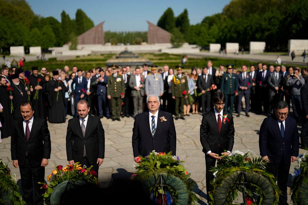 FILE — Russian ambassador in Germany Sergey Nechayev, center, attends a wreath laying ceremony to commemorate the end of World War II 77 years ago at the Soviet War Memorial at the district Treptow in Berlin, Germany, May 9, 2022. (AP Photo/Markus Schreiber, File)