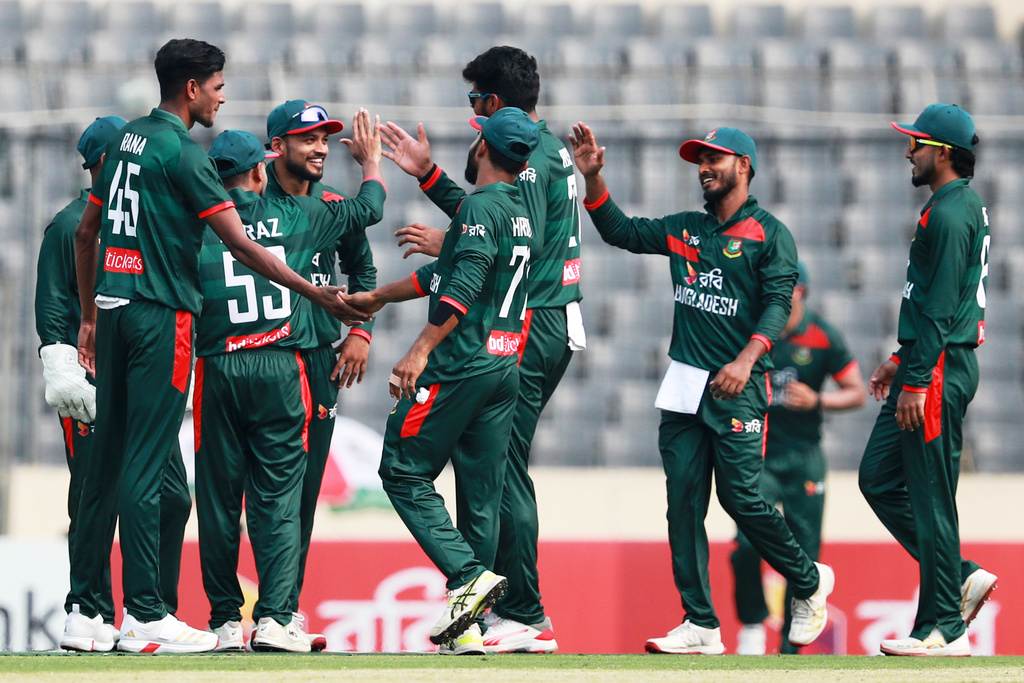 Bangladesh's Nahid Rana, left, celebrates with teammates the wicket of Pakistan's Shamyl Hussain during the first one day international cricket match between Bangladesh and Pakistan in Mirpur, Bangladesh, Wednesday, March 11, 2026. (AP Photo/Mahmud Hossain Opu)
