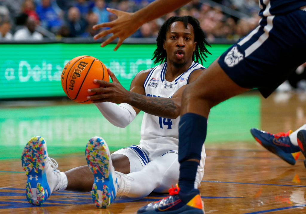 Seton Hall guard AJ Stanton-McCray looks to pass the ball while on the floor during the first half of an NCAA college basketball game against Butler Saturday, Jan. 17, 2026, in Newark. (AP Photo/John Munson)