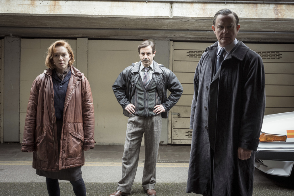 This image released by PBS Masterpiece shows Charlotte Spencer, from left, Emun Elliott, and Hugh Bonneville in a scene from "The Gold." (Sally Mais/All3Media and Masterpiece via AP)