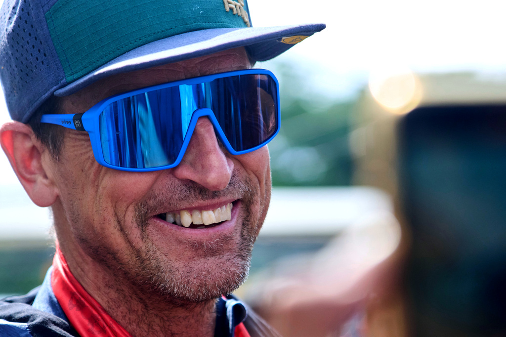 British mountain guide Kenton Cool, who scaled Mount Everest Sunday for the 20th time breaking his own record for the most ascents of the world's highest mountain by a non-Sherpa guide, arrives at the airport in Kathmandu, Nepal, Sunday, May 24, 2026. (AP Photo/Niranjan Shrestha)