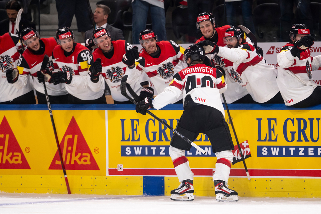 Austria's Tim Harnisch celebrates scoring during the Men's Ice Hockey World Championship preliminary round game between Latvia and Austria, in Zurich, Switzerland, Tuesday May 19, 2026. (Andreas Becker/Keystone via AP)