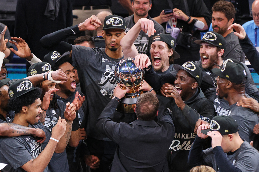 The San Antonio Spurs celebrate after defeating the Oklahoma City Thunder in the Western Conference finals of the NBA basketball playoffs series Saturday, May 30, 2026, in Oklahoma City. (AP Photo/Nate Billings)