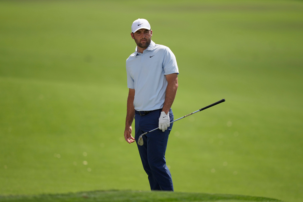 Scottie Scheffler watches his shot land on the first green during the second round of the Arnold Palmer Invitational at Bay Hill golf tournament Friday, March 6, 2026, in Orlando, Fla. (AP Photo/Matt Slocum)