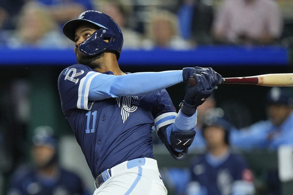 Kansas City Royals' Maikel Garcia watches his two run home home run during the third inning of a baseball game against the Minnesota Twins, Friday, Sept. 5, 2025, in Kansas City, Mo. (AP Photo/Charlie Riedel)