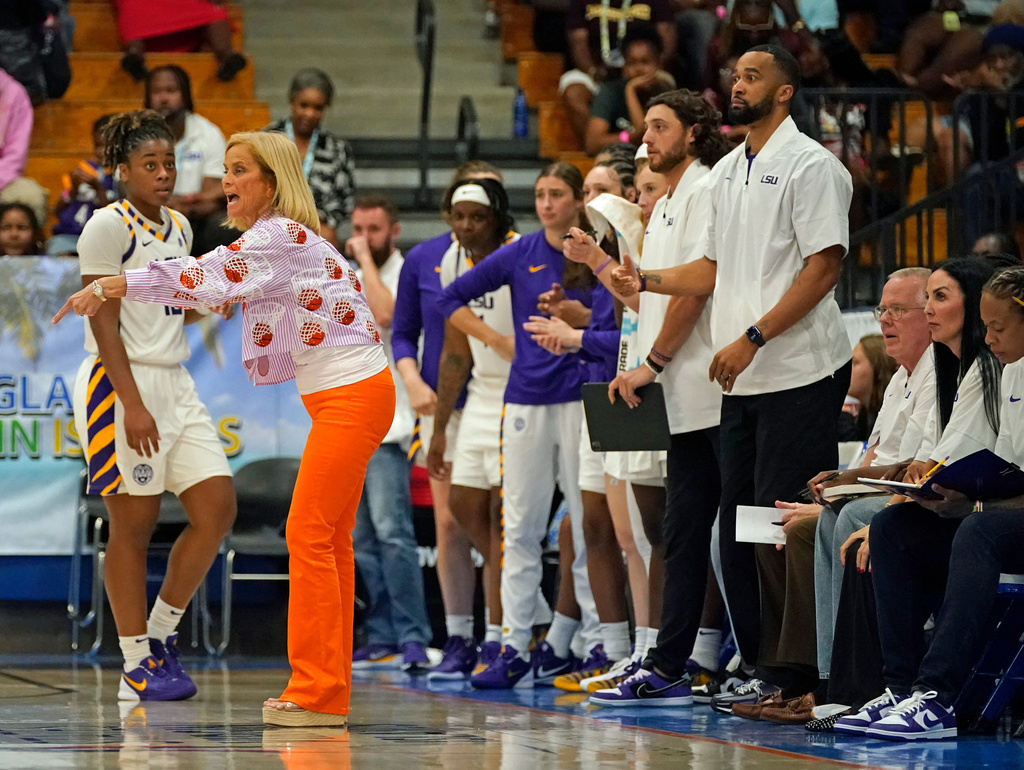 LSU head coach Kim Mulkey, left, yells instructions to her players during the first quarter of their Reef Division championship game at the Paradise Jam NCAA college basketball tournament in St. Thomas, U.S. Virgin Islands, Saturday, Nov. 29, 2025. (Bill Kiser/Virgin Islands Daily News via AP)