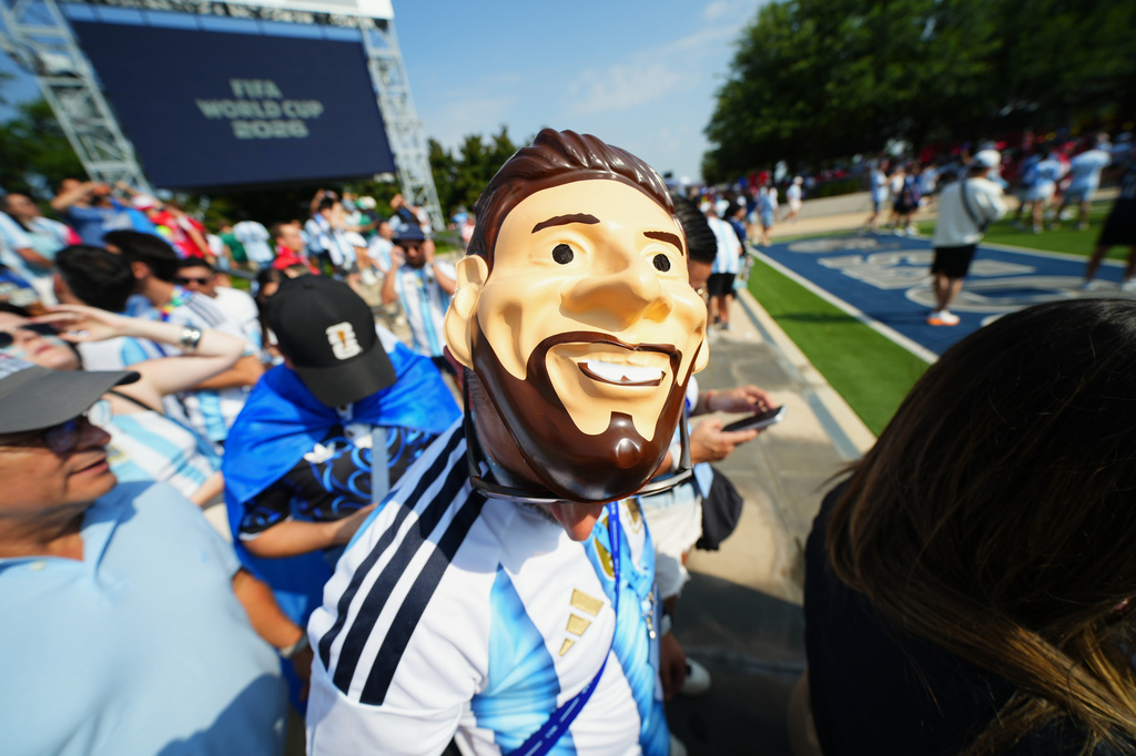 An Argentina fan wears a mask of Argentina's Lionel Messi outside the stadium before the World Cup Group J soccer match between Argentina and Austria in Arlington, Texas, near Dallas, Monday, June 22, 2026. (AP Photo/Julio Cortez)