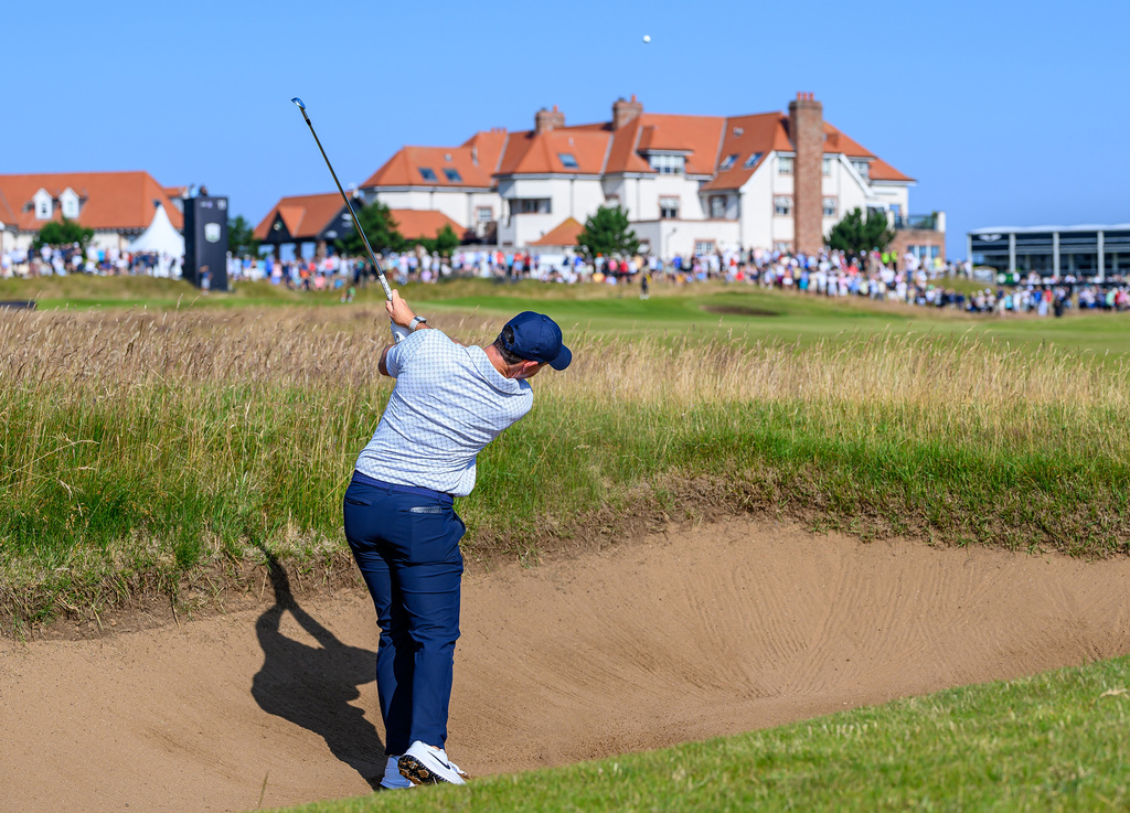 Rory McIlroy, of Northern Ireland, plays from a bunker on the 11th hole during day one of the Genesis Scottish Open 2026 at The Renaissance Club in North Berwick, Scotland, Thursday, July 9, 2026. (Malcolm Mackenzie/PA via AP)