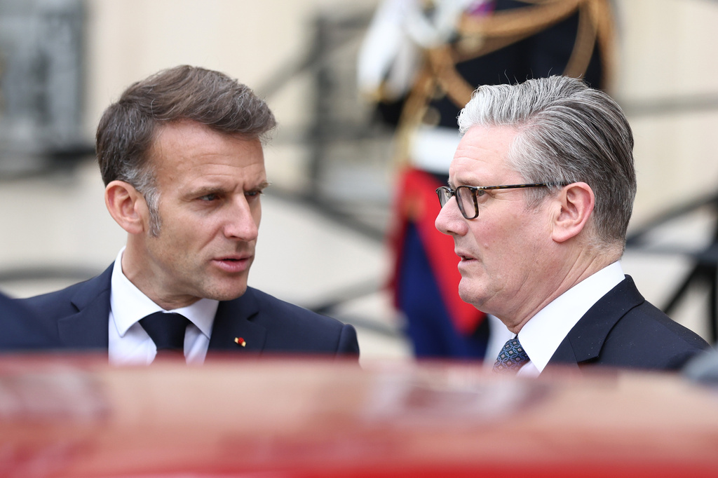 British Prime Minister Keir Starmer, right, and French President Emmanuel Macron speak as they leave after the multinational virtual summit and press conference at the Elysee Presidential Palace in Paris, Friday April 17, 2026 (Tom Nicholson/Pool Photo via AP)