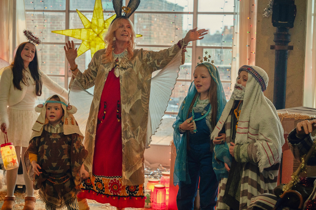 This image released by Netflix shows Toni Collette, center, in a scene from "Goodbye June." (Netflix via AP)