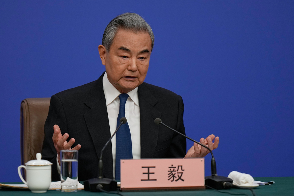 Chinese Foreign Minister Wang Yi speaks during a press conference on the sideline of the National People's Congress (NPC) at the media center, in Beijing, Sunday, March 8, 2026. (AP Photo/Andy Wong)