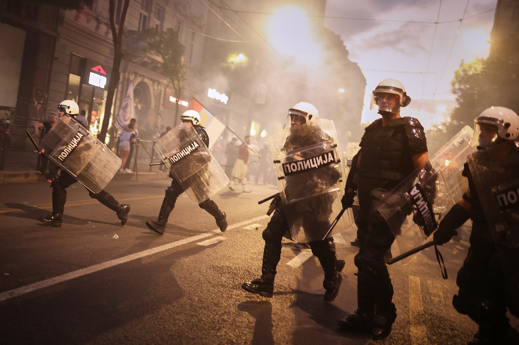 Riot police move in to disperse anti-government protesters during a rally led by Serbia's protesting university students who are pushing for major political changes in the Balkan country run by President Aleksandar Vucic, in Belgrade, Serbia, Saturday, May. 23, 2026. (AP Photo/Armin Durgut)