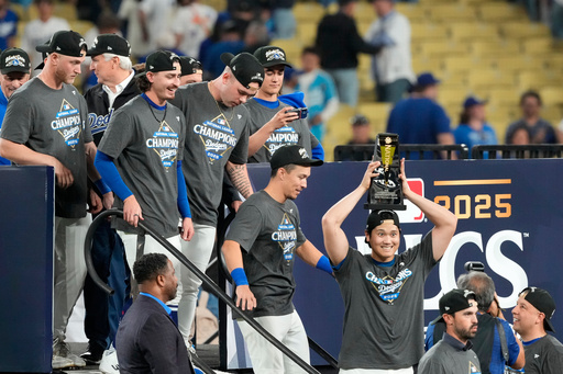 Los Angeles Dodgers' Shohei Ohtani celebrates the the trophy after their win against the Milwaukee Brewers in baseball's National League Championship Series, Friday, Oct. 17, 2025, in Los Angeles. (AP Photo/Mark J. Terrill) Los Angeles Dodgers' Shohei Ohtani celebrates the the trophy after their win against the Milwaukee Brewers in baseball's National League Championship Series, Friday, Oct. 17, 2025, in Los Angeles. (AP Photo/Mark J. Terrill)