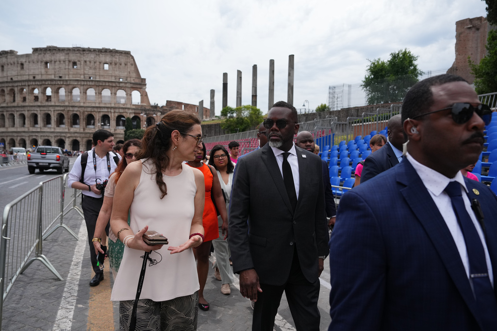 Chicago's Mayor Brandon Johnson, center, arrives for a tour at the Metro C Colosseum train station in Rome, Friday, May 29, 2026. (AP Photo/Alessandra Tarantino)