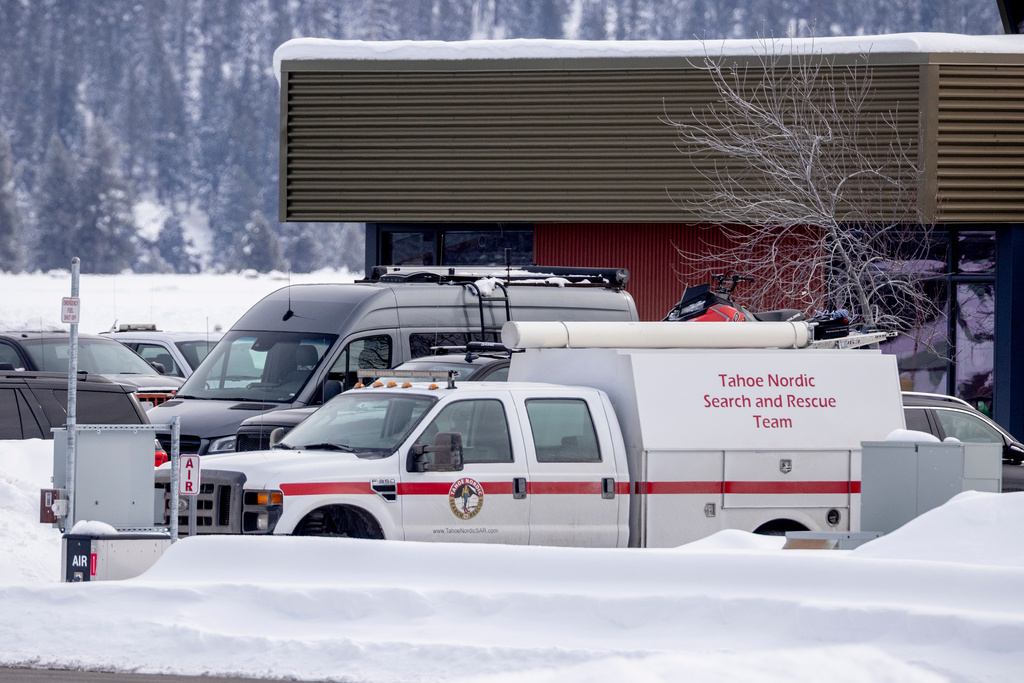 A Tahoe Nordic Search and Rescue Team vehicle is seen outside Truckee Airport, as the effort continues to recover the bodies of skiers who died during an avalanche, in Truckee, Calif., Saturday, Feb. 21, 2026. (Stephen Lam/San Francisco Chronicle via AP)