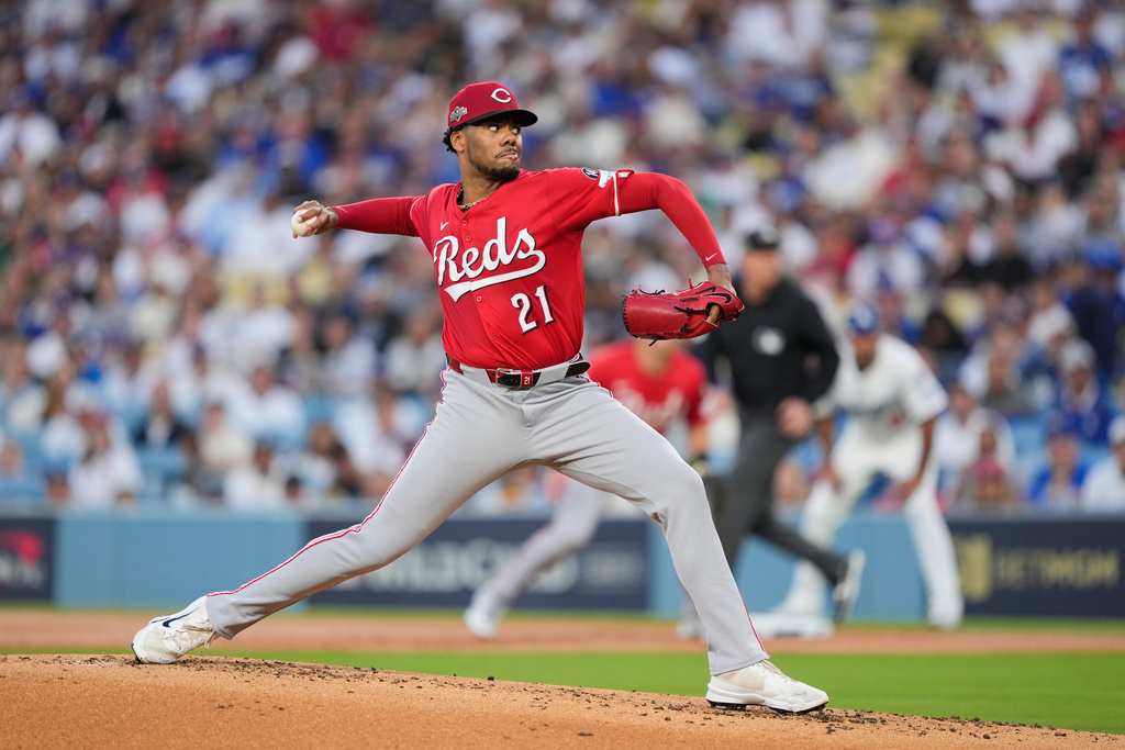 Cincinnati Reds starting pitcher Hunter Greene throws to a Los Angeles Dodgers batter during the first inning in Game 1 of the National League Wild Card baseball playoff series against the Cincinnati Reds, Tuesday, Sept. 30, 2025, in Los Angeles. (AP Photo/Mark J. Terrill)