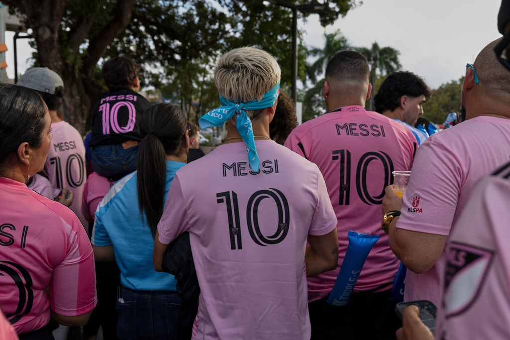 Fans wearing Inter Miami's Lionel Messi jersey are seen before the start of an international friendly soccer match against Ecuador's Independiente del Valle in Bayamon, Puerto Rico, Thursday, Feb. 26, 2026. (AP Photo/Alejandro Granadillo)