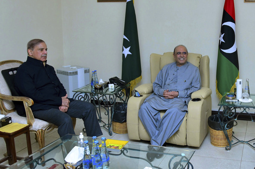In this photo released by Prime Minister Office, Prime Minister Shehbaz Sharif, left, meets with newly election Pakistan's President Asif Ali Zardari, in Islamabad, Pakistan, Saturday, March 9, 2023. Pakistan's lawmakers have chosen Zardari as the country's new president. It's his second time in the job. Zardari is the widower of assassinated former Premier Benazir Bhutto and the father of former Foreign Minister Bilawal Bhutto-Zardari, (Prime Minister Office via AP)