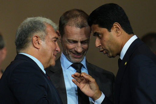 UEFA President Aleksander Ceferin, center, FC Barcelona president Joan Laporta, left, and PSG president Nasser Al-Khelaifi speak before the Champions League opening phase soccer match between Barcelona and Paris Saint-Germain at the Lluis Companys Olympic Stadium in Barcelona, Spain, Wednesday, Oct.1, 2025. (AP Photo/Emilio Morenatti) UEFA President Aleksander Ceferin, center, FC Barcelona president Joan Laporta, left, and PSG president Nasser Al-Khelaifi speak before the Champions League opening phase soccer match between Barcelona and Paris Saint-Germain at the Lluis Companys Olympic Stadium in Barcelona, Spain, Wednesday, Oct.1, 2025. (AP Photo/Emilio Morenatti)