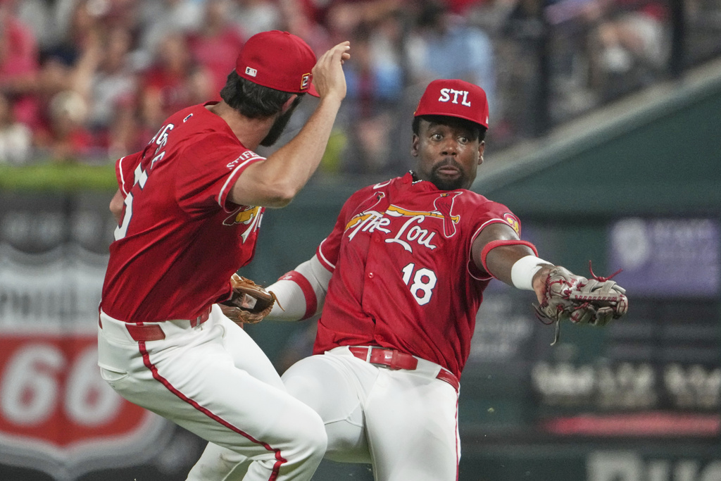 St. Louis Cardinals right fielder Jordan Walker, right, catches a fly ball by New York Yankees' Jasson Dominguez as Thomas Saggese, left, watches during the sixth inning of a baseball game Friday, Aug. 15, 2025, in St. Louis. (AP Photo/Jeff Roberson)