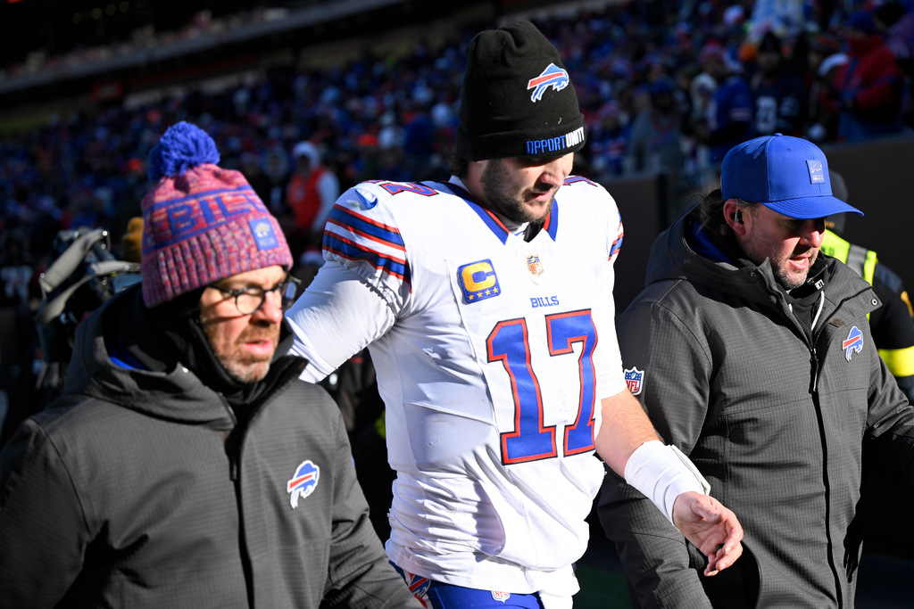 Buffalo Bills quarterback Josh Allen (17) leaves the field after an injury against the Cleveland Browns during the first half of an NFL football game in Cleveland, Sunday, Dec. 21, 2025. (AP Photo/David Richard)