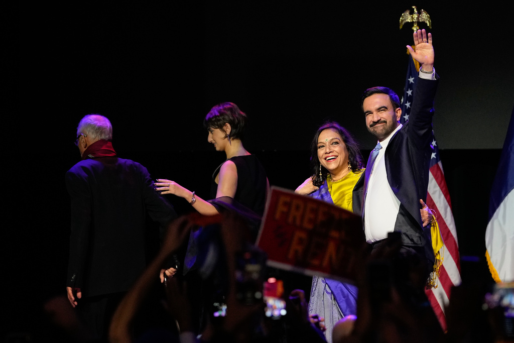 Mayor-elect Zohran Mamdani, right, walks off the stage with his mother, Mira Nair, second from right, his wife Rama Duwaji, and father Mahmood Mamdani, after making his acceptance speech at election night watch party, Tuesday, Nov. 4, 2025, in New York. (AP Photo/Yuki Iwamura)