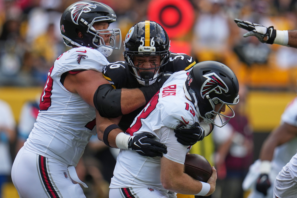 Atlanta Falcons quarterback Cooper Rush (13) is sacked by Pittsburgh Steelers linebacker Alex Highsmith (56) during an NFL football game Sunday, Sept. 13, 2026, in Pittsburgh. (AP Photo/Gene J. Puskar)
