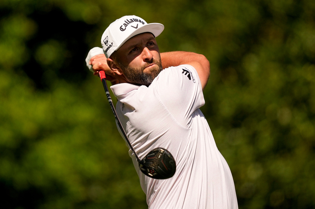 Jon Rahm, of Spain, watches his tee shot on the 11th hole during the first round of the Masters golf tournament at the Augusta National Golf Club, Thursday, April 9, 2026, in Augusta, Ga. (AP Photo/Gerald Herbert)