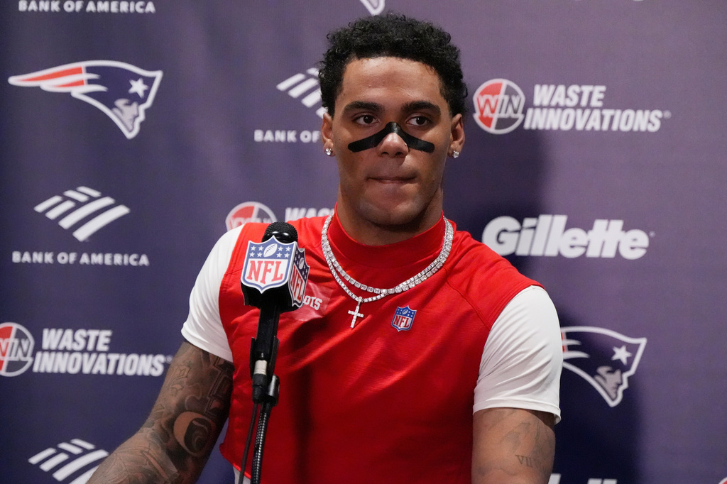 New England Patriots cornerback Christian Gonzalez (0) speaks in a press conference after an NFL football game against the Jacksonville Jaguars in Jacksonville, Fla., Sunday, Sept. 27, 2026. (AP Photo/Mike Stewart)
