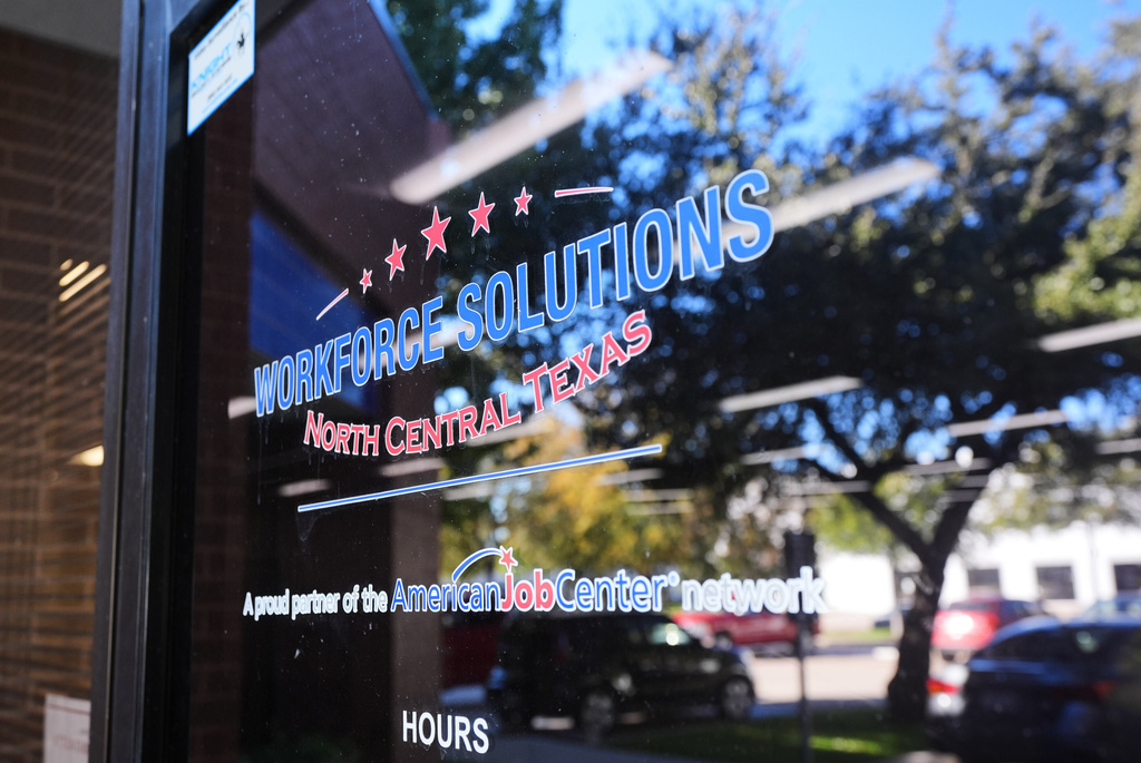 The front entry of a Workforce Solutions of North Central Texas office is shown, Thursday, Oct. 30, 2025, in Plano, Texas. (AP Photo/Tony Gutierrez)