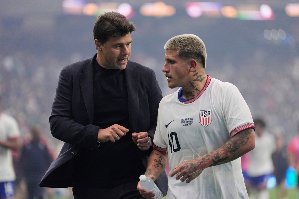 FILE - United States head coach Mauricio Pochettino, left, talks with midfielder Diego Luna (10) as they walk off the field at halftime of the team's CONCACAF Gold Cup final soccer match against Mexico in Houston, Sunday, July 6, 2025. (AP Photo/Ashley Landis, File)