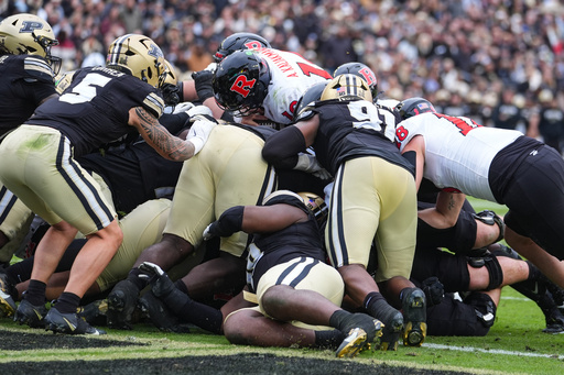 Rutgers quarterback Athan Kaliakmanis (16) runs in for a touchdown against Purdue during the second half of an NCAA college football game in West Lafayette, Ind., Saturday, Oct. 25, 2025. (AP Photo/Michael Conroy) Rutgers quarterback Athan Kaliakmanis (16) runs in for a touchdown against Purdue during the second half of an NCAA college football game in West Lafayette, Ind., Saturday, Oct. 25, 2025. (AP Photo/Michael Conroy)